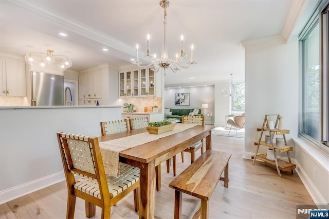 1 Claridge Dr Unit 418, Verona, NJ 07044 - dining room featuring a chandelier, ornamental molding, light wood-style flooring, and recessed lighting
