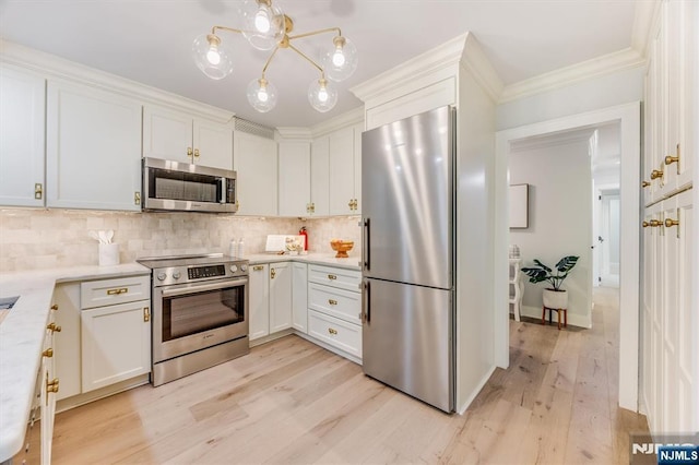 1 Claridge Dr Unit 418, Verona, NJ 07044 - kitchen featuring stainless steel appliances, light wood finished floors, decorative backsplash, white cabinets, and crown molding