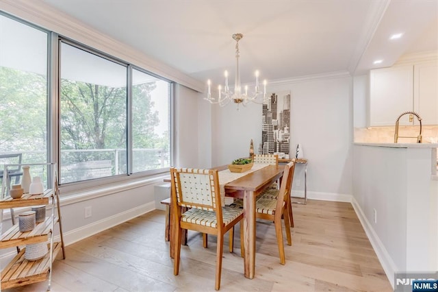 1 Claridge Dr Unit 418, Verona, NJ 07044 - dining area featuring a chandelier, light wood finished floors, and crown molding