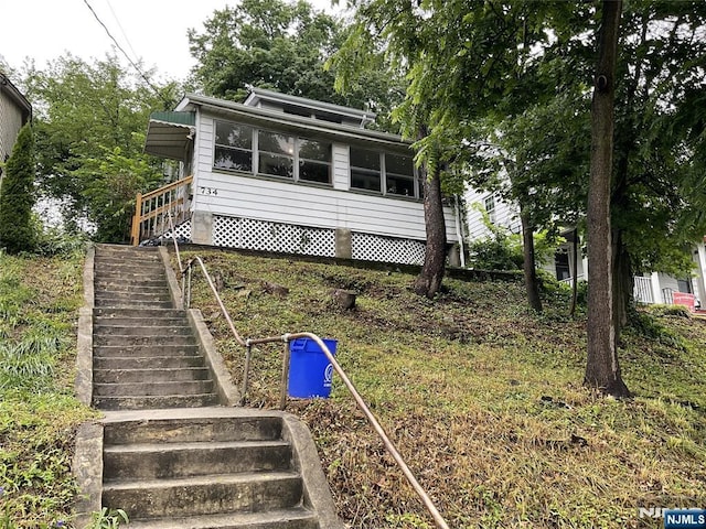734 Broad St, Bloomfield, NJ 07003 - view of front of property featuring stairs and a sunroom