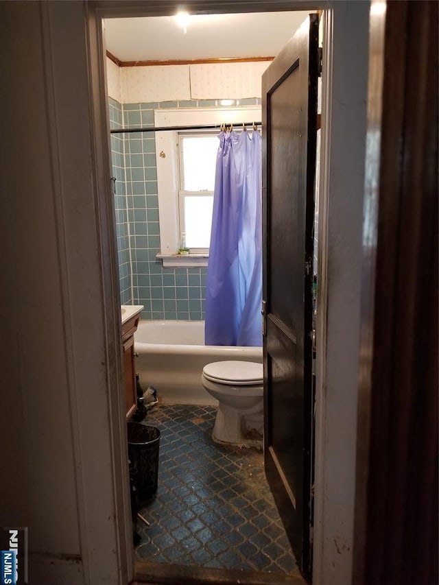 734 Broad St, Bloomfield, NJ 07003 - bathroom with tile patterned floors, vanity, and shower / bath combo with shower curtain