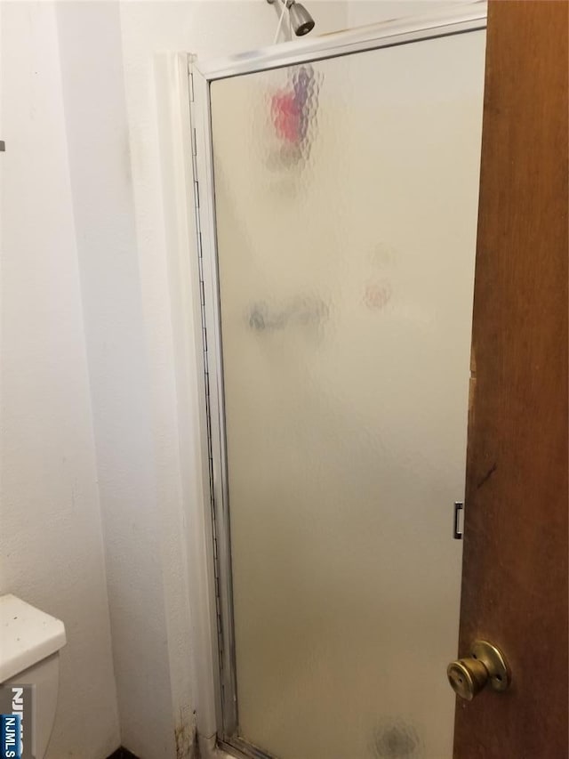 734 Broad St, Bloomfield, NJ 07003 - bathroom featuring a stall shower and toilet