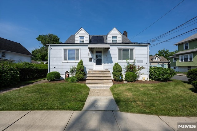 71 Pickens St, Little Ferry, NJ 07643 - view of front of home featuring a front yard and a chimney