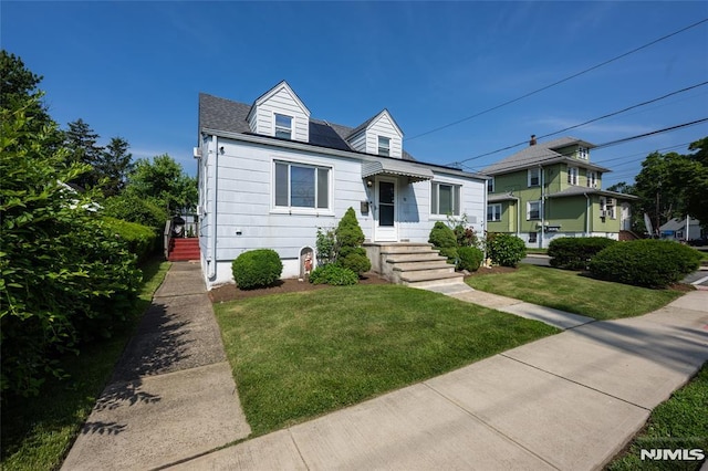 71 Pickens St, Little Ferry, NJ 07643 - view of front facade with a front lawn