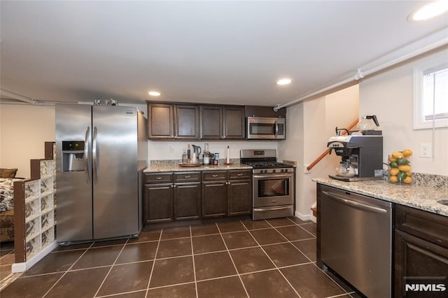 71 Pickens St, Little Ferry, NJ 07643 - kitchen featuring stainless steel appliances, dark brown cabinets, dark tile patterned flooring, recessed lighting, and light stone counters