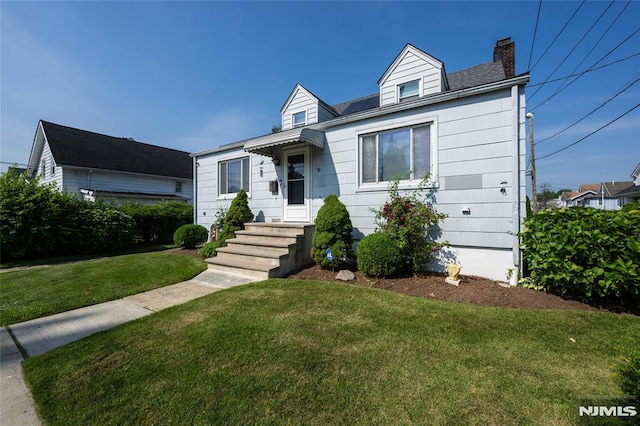 71 Pickens St, Little Ferry, NJ 07643 - cape cod home with a chimney and a front lawn