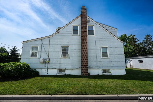 71 Pickens St, Little Ferry, NJ 07643 - view of side of property with a chimney and a yard