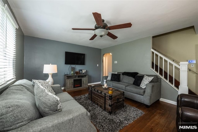 71 Pickens St, Little Ferry, NJ 07643 - living area with wood finished floors, ceiling fan, arched walkways, and stairs