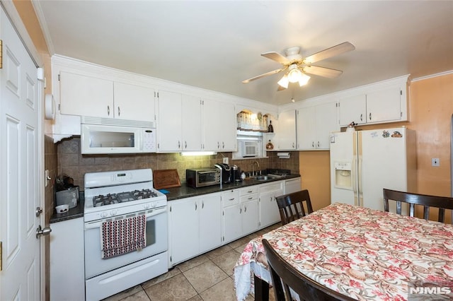 71 Pickens St, Little Ferry, NJ 07643 - kitchen with white appliances, dark countertops, ceiling fan, decorative backsplash, and white cabinets