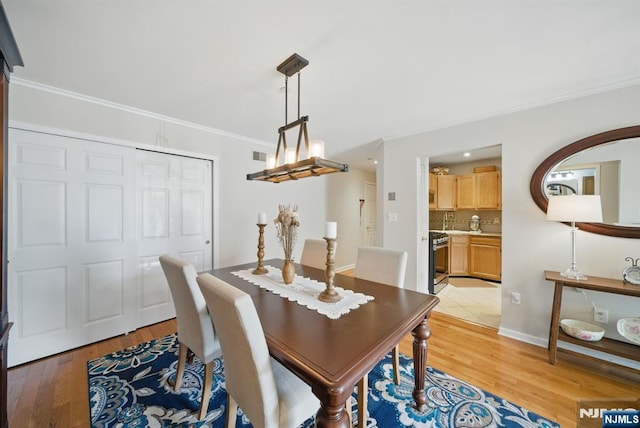 92 Maple Ln Unit 3021, Mount Arlington Boro, NJ 07856 - dining area with light wood finished floors, arched walkways, and crown molding