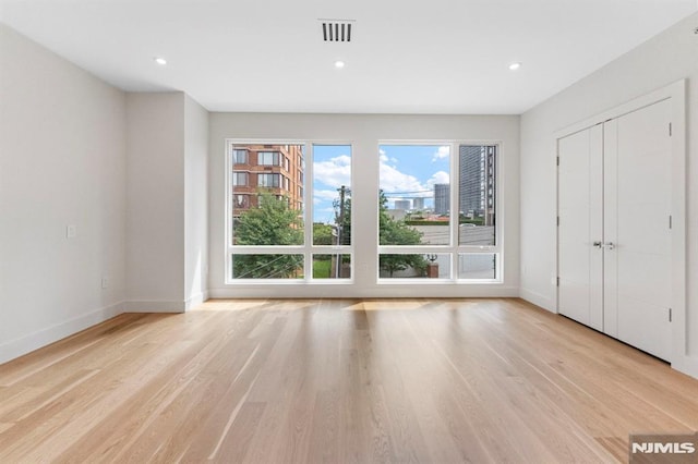 135 Old Palisade Rd, Fort Lee, NJ 07024 - unfurnished living room with light wood-type flooring and recessed lighting