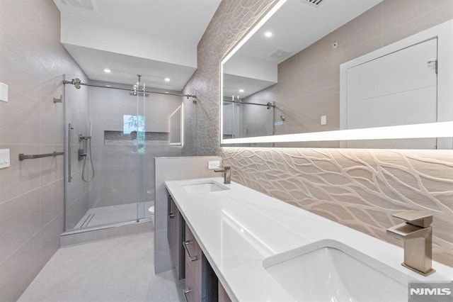 135 Old Palisade Rd, Fort Lee, NJ 07024 - bathroom with tile walls, a stall shower, double vanity, and recessed lighting