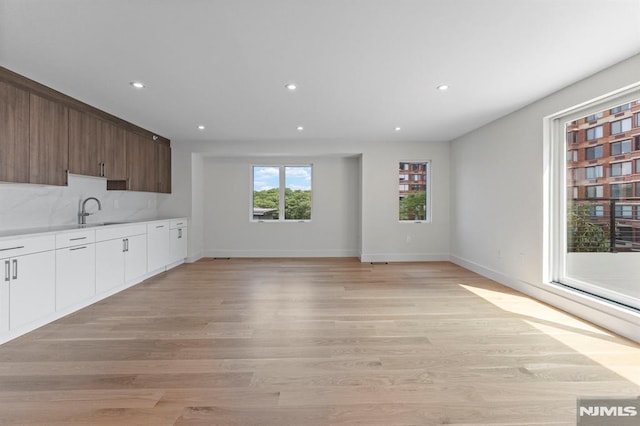 135 Old Palisade Rd, Fort Lee, NJ 07024 - kitchen featuring recessed lighting, light wood-style flooring, light countertops, white cabinetry, and modern cabinets