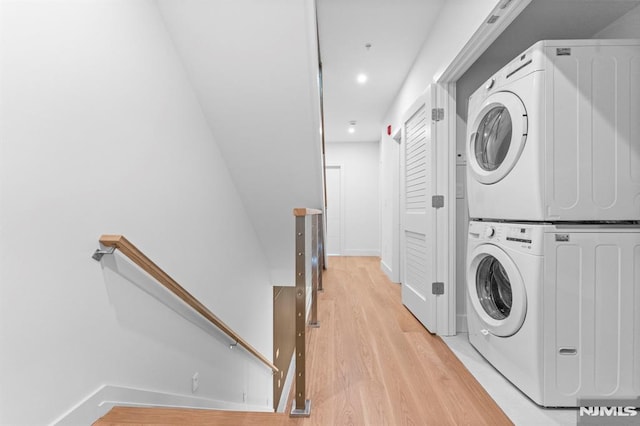 135 Old Palisade Rd, Fort Lee, NJ 07024 - washroom with estacked washer and dryer, light wood-style flooring, and recessed lighting
