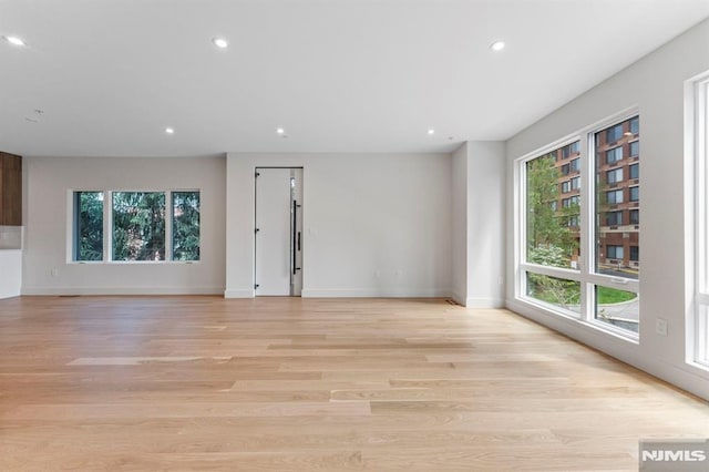 135 Old Palisade Rd, Fort Lee, NJ 07024 - spare room with plenty of natural light, recessed lighting, and light wood-style flooring