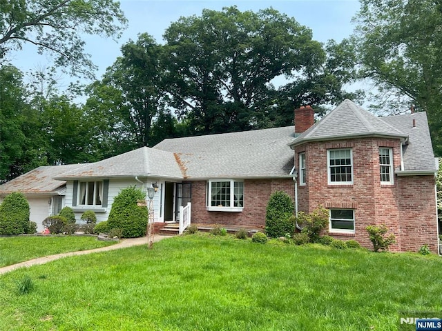 106 Prescott St, Demarest, NJ 07627 - view of front of property with a chimney, brick siding, roof with shingles, and a front yard