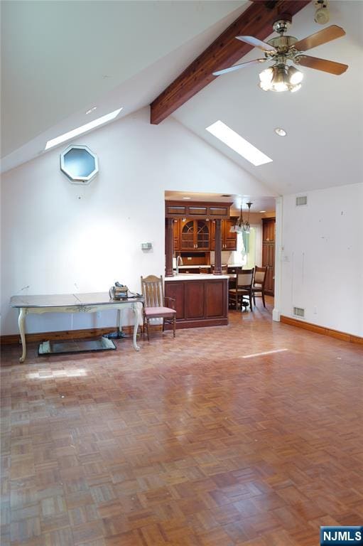 106 Prescott St, Demarest, NJ 07627 - living area with a skylight, beam ceiling, ceiling fan, and high vaulted ceiling