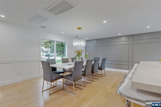 415 Bailey Rd, Paramus, NJ 07652 - dining room featuring a decorative wall, a chandelier, light wood-type flooring, and recessed lighting