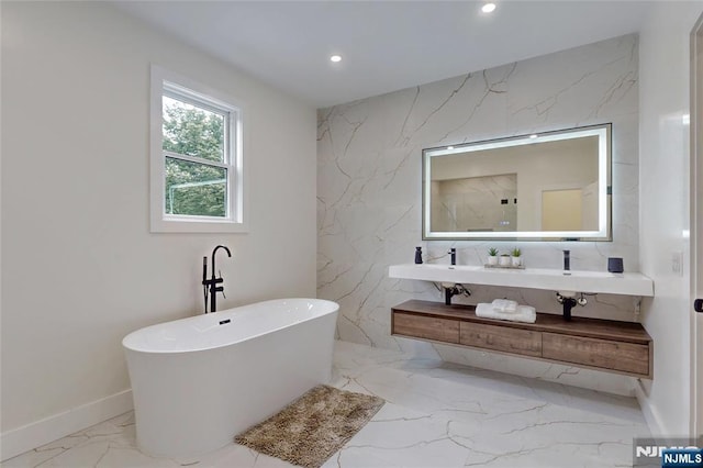 415 Bailey Rd, Paramus, NJ 07652 - full bathroom with marble tiled floors, recessed lighting, a freestanding tub, and double vanity