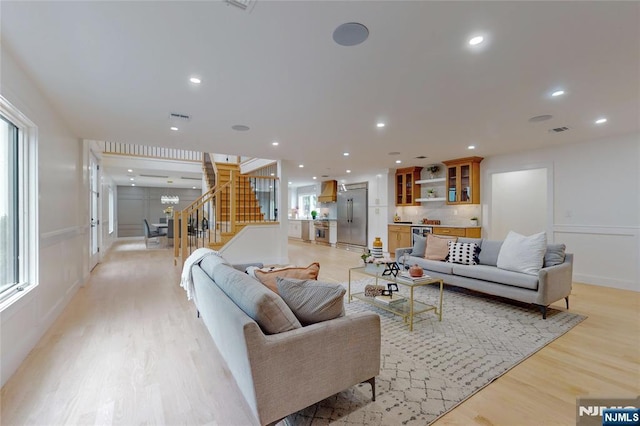 415 Bailey Rd, Paramus, NJ 07652 - living room with stairs, light wood-style floors, plenty of natural light, and recessed lighting