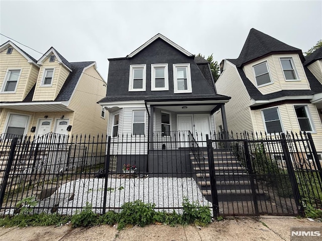 1 9th Ave, East Orange, NJ 07018 - view of front of property featuring a fenced front yard and a shingled roof