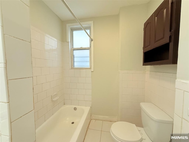 1 9th Ave, East Orange, NJ 07018 - full bath with tile patterned flooring, bathtub / shower combination, and tile walls