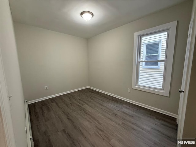 1 9th Ave, East Orange, NJ 07018 - empty room with dark wood-style flooring