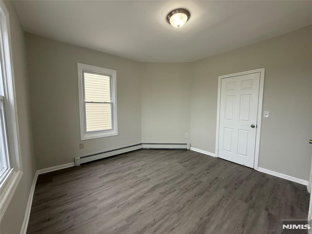 1 9th Ave, East Orange, NJ 07018 - empty room with dark wood-type flooring and baseboards