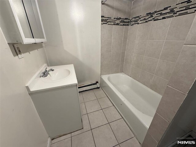 1 9th Ave, East Orange, NJ 07018 - full bath with a baseboard radiator, vanity, tile patterned flooring, and bathtub / shower combination