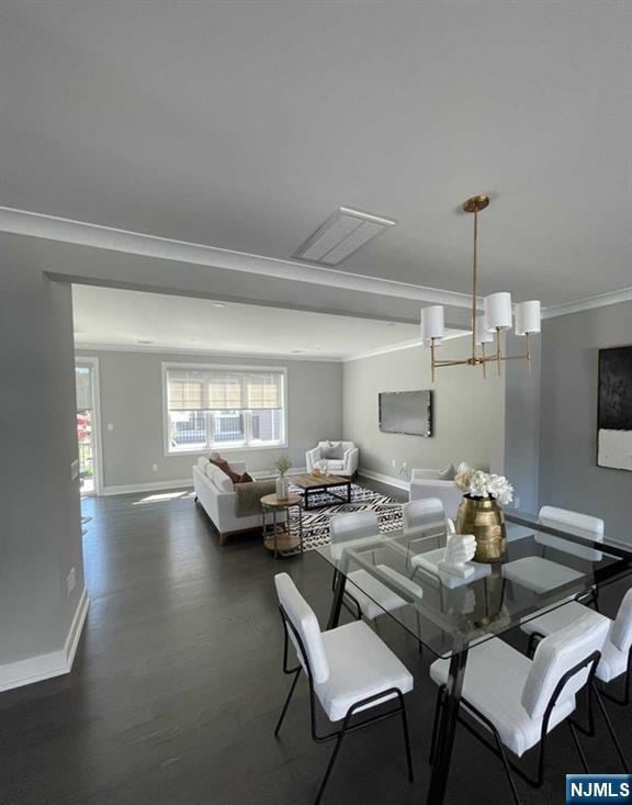 25 Division St Unit 403, Cresskill, NJ 07626 - dining space with crown molding, a chandelier, and wood finished floors