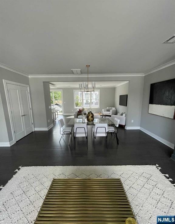 25 Division St Unit 403, Cresskill, NJ 07626 - dining area featuring crown molding and wood finished floors