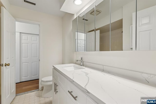 7 Eakens Ct, Mahwah, NJ 07430 - bathroom featuring vanity and toilet