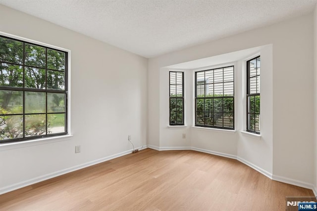 7 Eakens Ct, Mahwah, NJ 07430 - empty room featuring light wood-type flooring and a textured ceiling