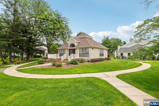 7 Eakens Ct, Mahwah, NJ 07430 - view of front of home with a front lawn and roof with shingles