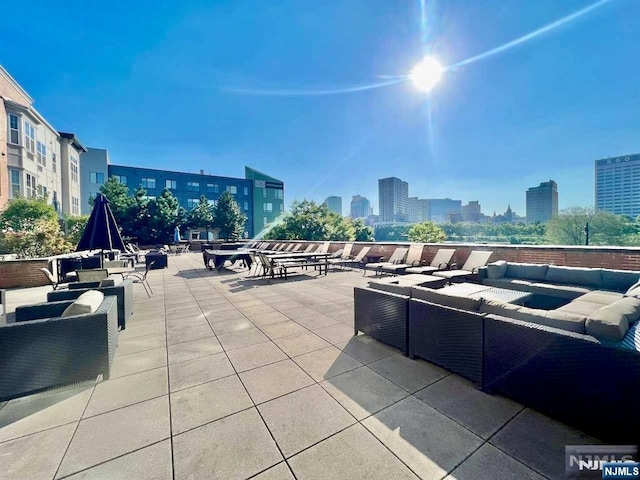 200 Dey St Unit 282, Harrison, NJ 07029 - view of patio with an outdoor living space and a view of city