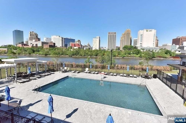 200 Dey St Unit 282, Harrison, NJ 07029 - community pool featuring a view of skyline, a water view, and a patio