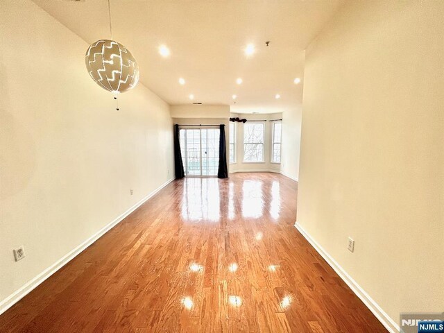 200 Dey St Unit 282, Harrison, NJ 07029 - unfurnished living room featuring light wood-style floors and recessed lighting