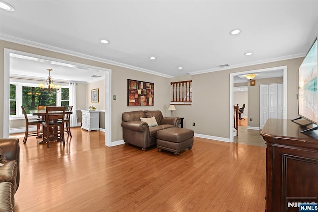 8 Fieldstone Dr, Kinnelon Borough, NJ 07405 - living room featuring light wood-style floors, crown molding, recessed lighting, and a chandelier