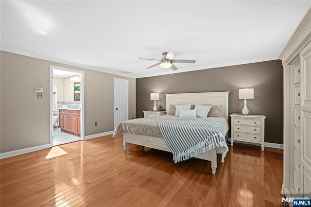 8 Fieldstone Dr, Kinnelon Borough, NJ 07405 - bedroom featuring ornamental molding, light wood-style flooring, a ceiling fan, and ensuite bath