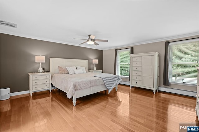 8 Fieldstone Dr, Kinnelon Borough, NJ 07405 - bedroom with a baseboard heating unit, light wood-style flooring, crown molding, and ceiling fan