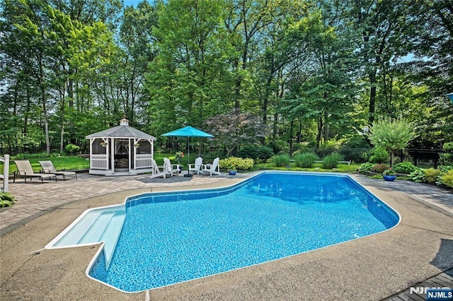 8 Fieldstone Dr, Kinnelon Borough, NJ 07405 - swimming pool with a gazebo, a patio, and view of wooded area