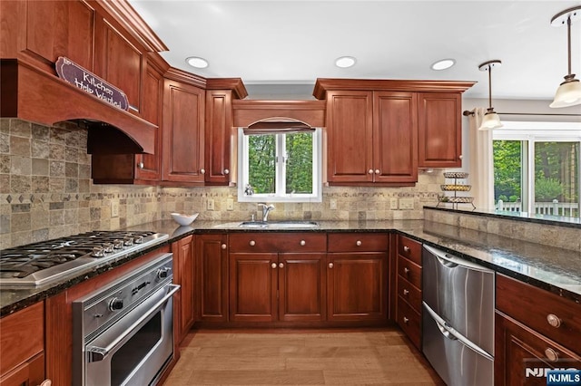 8 Fieldstone Dr, Kinnelon Borough, NJ 07405 - kitchen featuring stainless steel appliances, dark stone countertops, hanging light fixtures, backsplash, and recessed lighting