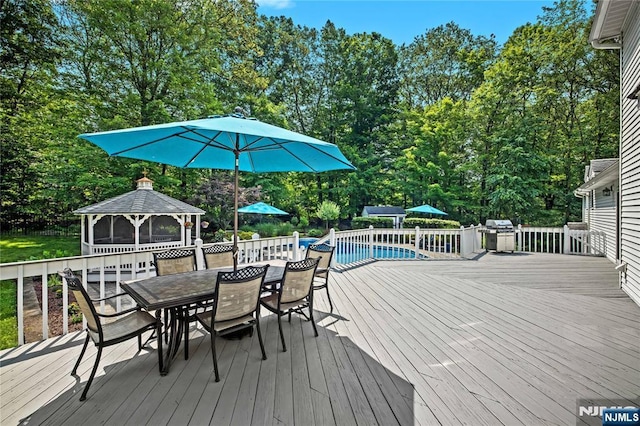 8 Fieldstone Dr, Kinnelon Borough, NJ 07405 - wooden deck featuring a gazebo, outdoor dining area, and view of scattered trees