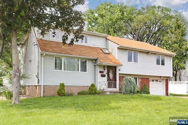 39-23 Pershing St, Fair Lawn, NJ 07410 - view of front facade featuring an attached garage and roof with shingles
