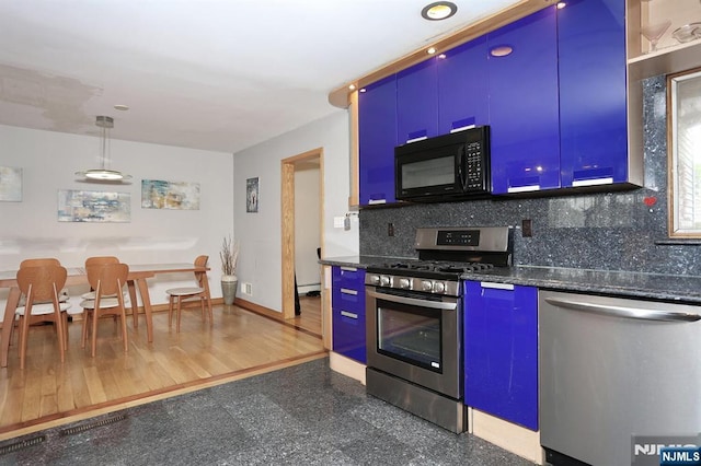 39-23 Pershing St, Fair Lawn, NJ 07410 - kitchen with stainless steel appliances, tasteful backsplash, granite tiled floors, recessed lighting, and blue cabinets