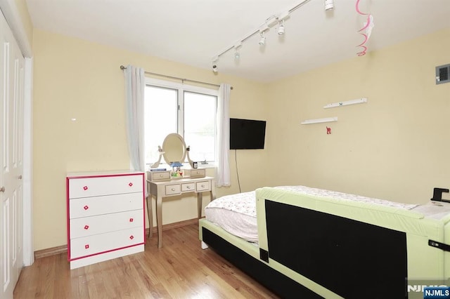 39-23 Pershing St, Fair Lawn, NJ 07410 - bedroom featuring wood finished floors and track lighting