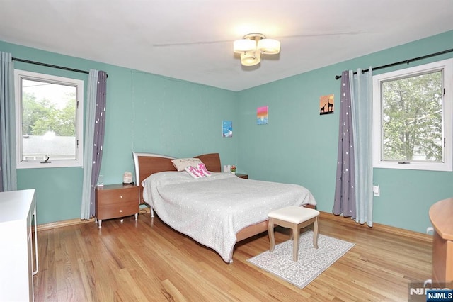 39-23 Pershing St, Fair Lawn, NJ 07410 - bedroom with multiple windows and light wood finished floors
