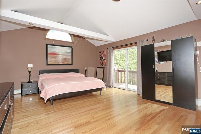 39-23 Pershing St, Fair Lawn, NJ 07410 - bedroom with access to outside, lofted ceiling, and light wood finished floors
