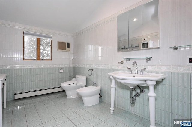 39-23 Pershing St, Fair Lawn, NJ 07410 - bathroom with a baseboard radiator, tile walls, tile patterned floors, vaulted ceiling, and a bidet