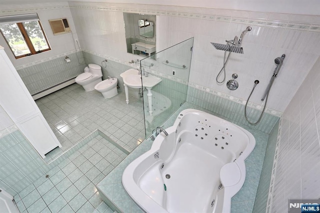 39-23 Pershing St, Fair Lawn, NJ 07410 - bathroom featuring a baseboard radiator, tile walls, tile patterned flooring, a whirlpool tub, and a bidet